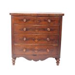 A Victorian flame mahogany bow front chest of drawers, with two short over three long graduated