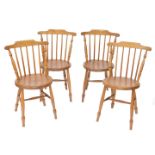 A set of four oak and elm spindle back kitchen chairs, with circular seats raised on turned legs