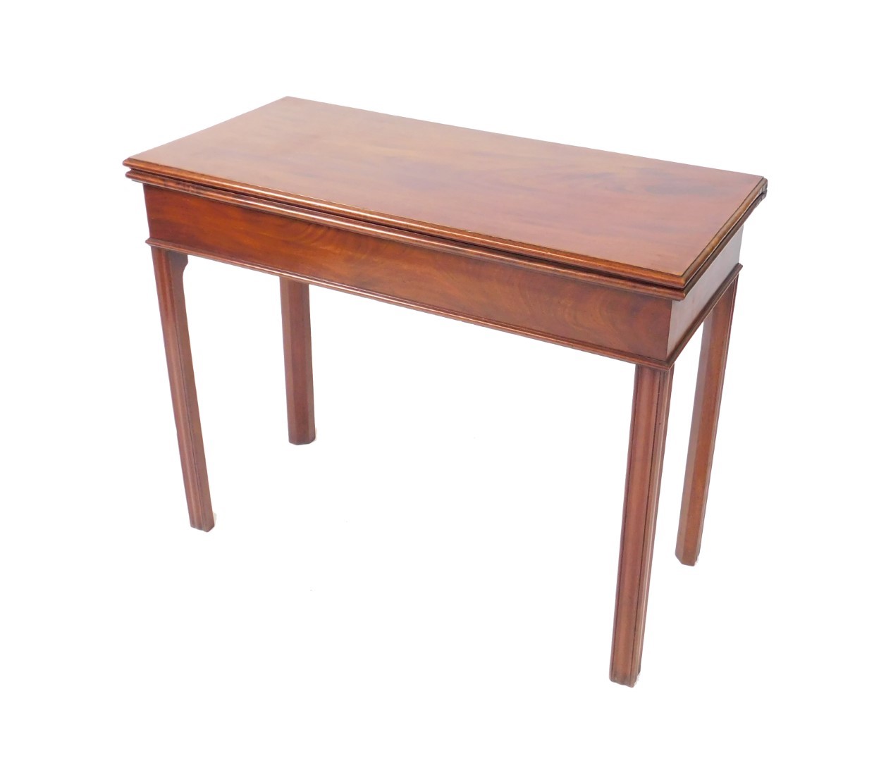A George III mahogany fold over tea table, raised on fluted square legs, 73cm H, 92cm W, 42.5cm D.