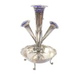 An Edward VII silver epergne, of four trumpet form, with four Bristol Blue glass flower holders,
