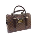 A Louis Vuitton Damier Ebene Berkeley hand bag, with exterior side pockets, dual rolled leather