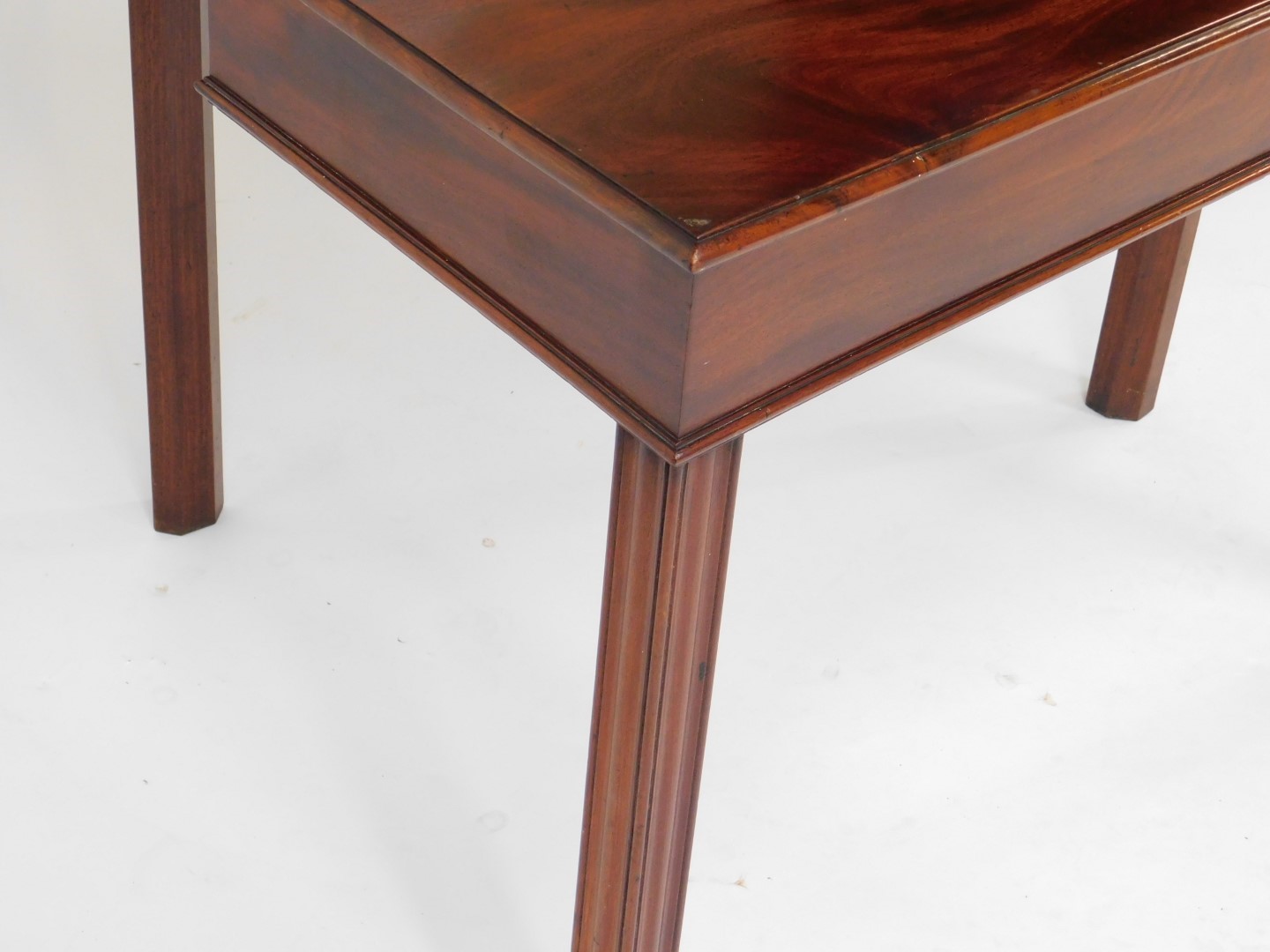 A George III mahogany fold over tea table, raised on fluted square legs, 73cm H, 92cm W, 42.5cm D. - Image 4 of 4