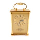 An Imhof brass cased mantel clock, rectangular dial with raised chapter ring bearing Roman numerals,