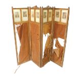 A Victorian neoclassical parcel gilt four fold screen, inset with French engravings above fabric