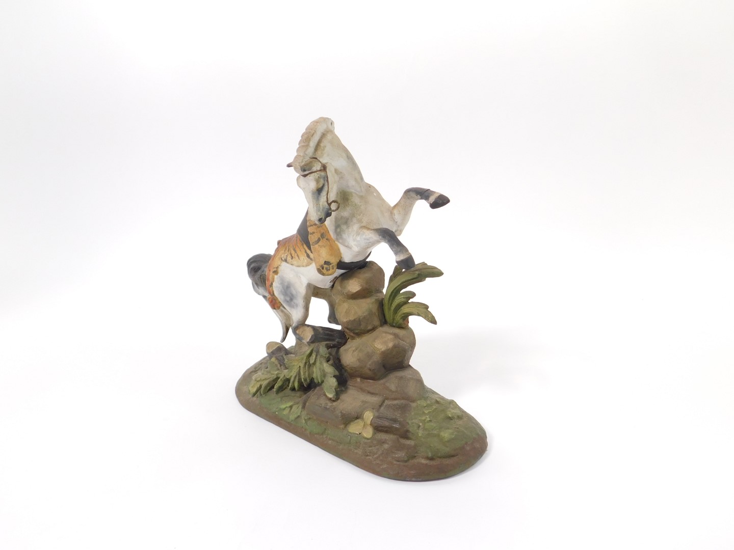 An early 20thC cold painted lead figure of a prancing horse, draped in a tiger skin, on a - Image 2 of 3