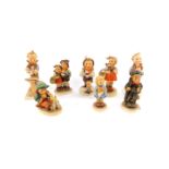 Eight Hummel figures, comprising Chimney Sweep, Surprise, Girl with nosegay, Singing Lesson,