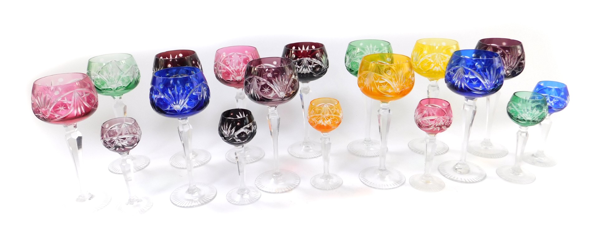 A set of twelve vari-coloured cut glass hock glasses, raised on hexagonal stems, together with six