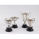 Four silver twin handled trophies, unengraved, Birmingham 1935, Birmingham 1933, Sheffield 1929