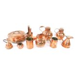 Victorian and later copper ware, including Jersey jugs, funnels, ale measures, and a shoe shaped ale