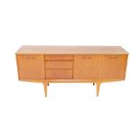 A Jentique teak sideboard, with an arrangement of three doors and three short drawers, raised on