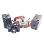 An Agfa camera, with a Silette Prontor-SVS lens, Vivitar 35ES camera, Kodak Brownie Junior six-20