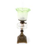 A Rippingilles duplex no 3 brass oil lamp, with a clear glass reservoir, chimney, and etched clear