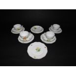 A Herend porcelain part tea service, painted with flowers and floral sprigs, comprising four tea