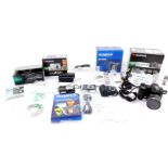 A Fujifilm Fine Pix S5600 digital camera, an Olympus SP-350 digital compact camera, Fujifilm Fine
