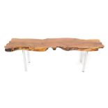 A yew wood plank top occasional table, raised on tubular steel legs, 53cm H, 173cm W, 50cm D.