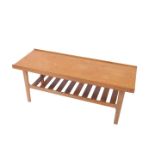 A 1960's teak rectangular occasional table, raised on straight legs united by a slatted under