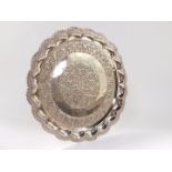 An Indian fluted circular salver, white metal, with repousse floral and foliate decoration, 29.63oz,