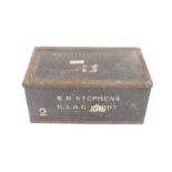 A military black painted and iron bound military chest, painted to the lid with H T Dunera,