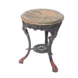 A Victorian cast iron pub table, with a circular wooden top, raised on cabriole legs, united by a