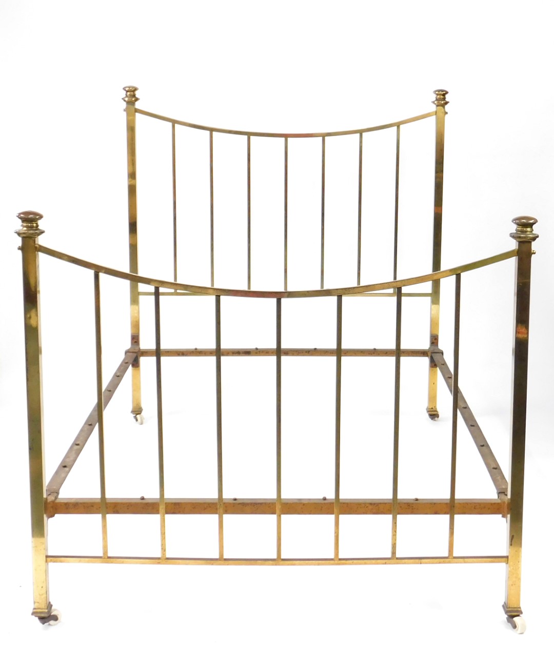 A late Victorian brass bed, with turned finials, upright rails, on ceramic castors, 149cm H, 141cm