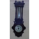 A Victorian oak cased wall barometer by T B Winter & Son, Newcastle on Tyne, with barometer, the
