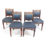 A set of four William IV mahogany dining chairs, with over stuffed back and serpentine seat