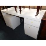 An Ikea white desk, with single drawer and cupboard, together with a filing chest, and a white