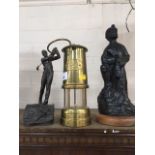 A brass Welsh miners lamp, figure of a miner, and a cold cast bronze model of a golfer by Derek