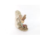 A Capodimonte porcelain figure of Michelangelo, modelled standing carving a sculpture, limited