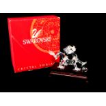 A Swarovski Crystal Zodiac figure Year of the Dragon, with 'pearl' and stand, boxed.(AF)