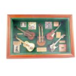 A montage to contemporary and popular music, framed and glazed, 34.5cm H, 52.5cm W.