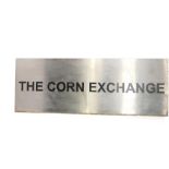 A metal fronted wall sign for The Corn Exchange, 97cm H, 267cm W.