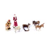 A Coalport porcelain figure modelled as Davina, a Beswick figure of a lamb, foal and two donkeys,