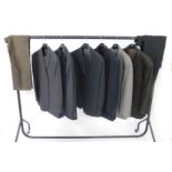 Six Hugo Boss suits and two pairs of Hugo Boss casual trousers.