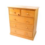 A pine chest of drawers, with two short over three long drawers, raised on a plinth base, 110.5cm H,