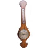 A Victorian oak cased barometer by Griffin & Hyams, Cornhill, London., with thermometer, the banjo