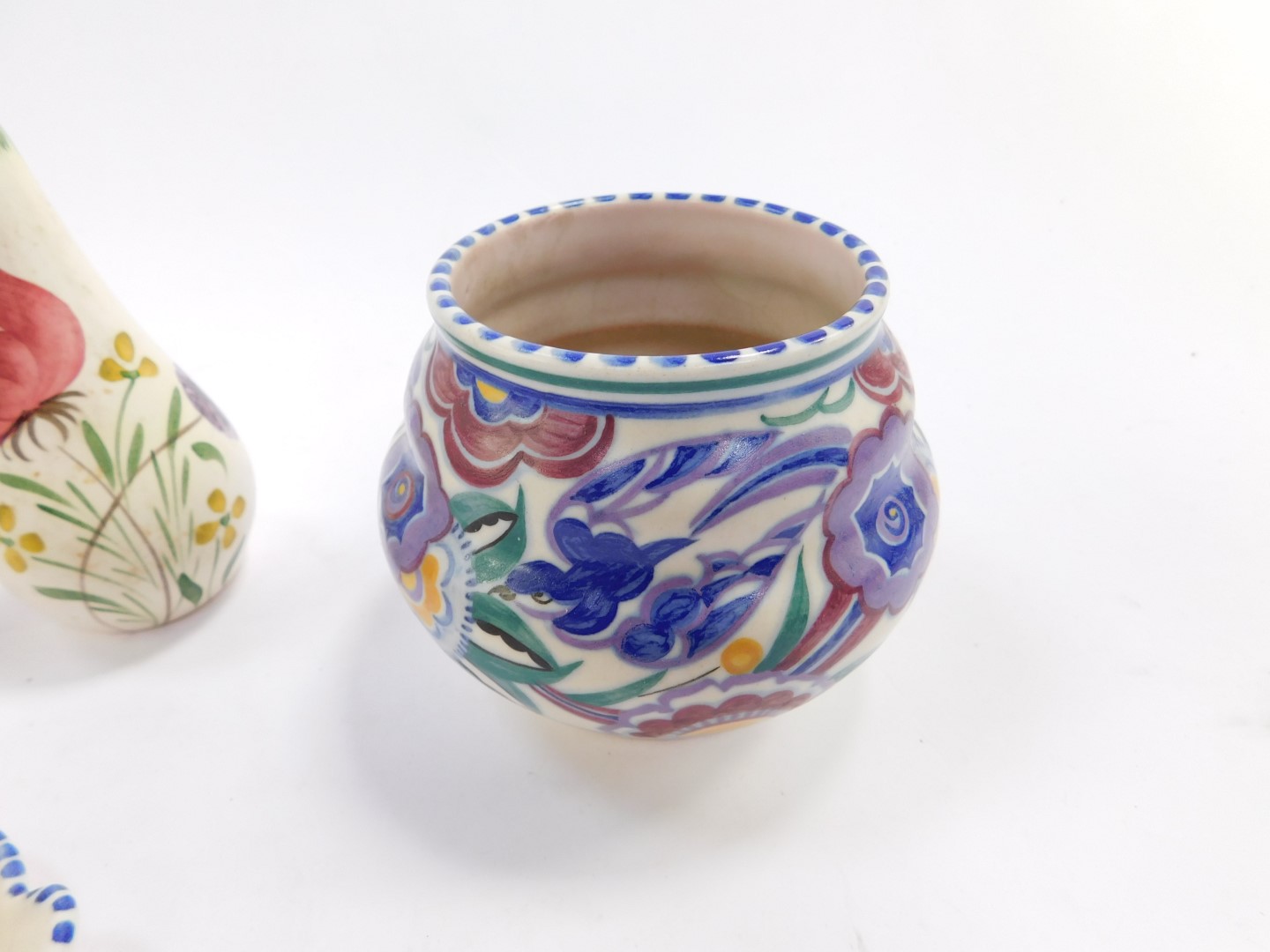 A group of Poole Pottery, traditionally painted with flowers, comprising a pair of candlesticks, - Image 2 of 3