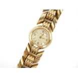 A Rolex lady's 9ct gold cased wristwatch, circular champagne dial bearing Arabic numerals at