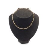 A 9ct gold necklace, of textured wavy form on a snap clasp, 8.5g.