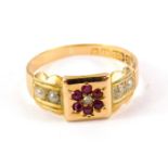 A Victorian 15ct gold seed pearl ruby and diamond ring, in a flower head tiered design, size N, 3.