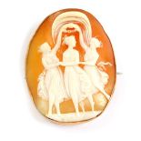 A 9ct gold and shell cameo oval brooch, carved with the Three Graces, 24.4g all in.