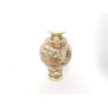 An early 20thC Japanese Satsuma vase, of baluster form, reserve decorated with ladies in a garden
