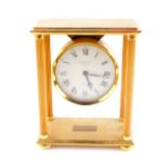 A Garrard and Company late 20thC gold plated brass mantel clock, of portico form, with fluted