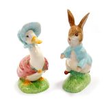 Two Beswick pottery figures of Jemima Puddleduck and Peter Rabbit, 15.5cm H and 17.5cm H