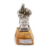 Isiah Aac Yeheskel. A silver sculpture of a Rabbi and pupil reading from the Tanakh, raised on a