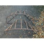 A pair of cast iron demi lune wall mounted hay racks, 84cm Dia.