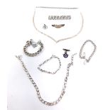 Silver jewellery, including a gate link bracelet, curb link bracelet on a heart shaped padlock