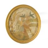A Georgian silk work picture, depicting a religious figure and two birds in a garden, oval framed,