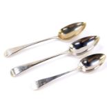 A pair of George III silver tablespoons, monogram engraved and numbered 2 and 6 respectively,