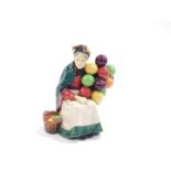 A Royal Doulton figure modelled as The Old Balloon Seller, HN1315.